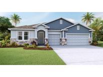 Charming single-Gathering home boasts a three-car garage, stone accents, and a beautifully landscaped front yard at 19695 Gladeview Way, Land O Lakes, FL 34638