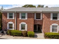 Charming two-story brick home featuring white shutters and lush landscaping at 3585 41St S Ter # 227, St Petersburg, FL 33711