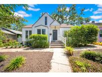 Charming two-story home with landscaped yard and inviting front porch at 150 23Rd N Ave, St Petersburg, FL 33704