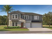 Two-story home with gray siding, stone accents, a two-car garage, manicured lawn, and a mature palm tree at 15238 Rainbow Quartz St, Wimauma, FL 33598