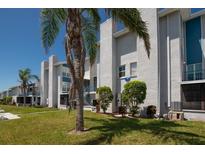 Charming condominium complex with well-maintained landscaping and ample green space at 171 Medallion Blvd # F, Madeira Beach, FL 33708