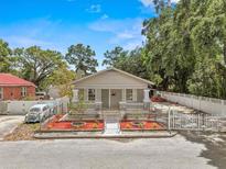 Charming single-story home with a well-manicured front yard and cozy, inviting curb appeal at 1209 E 29Th Ave, Tampa, FL 33605