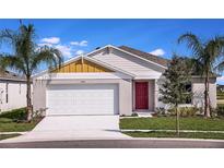 Charming single-Gathering home with a red front door, white garage, and well-maintained landscaping at 14781 Summer Branch Dr, Lithia, FL 33547