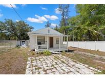 Charming single-story home with a front porch and well-maintained yard at 3310 70Th N Ave, St Petersburg, FL 33702
