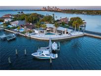 Stunning waterfront home with a private boat dock and a pool overlooking the bay with downtown views at 10 Brightwaters Ne Cir, St Petersburg, FL 33704