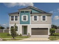 Charming two-story home featuring a modern design, landscaped yard, and a two-car garage at 10243 Fieldstone Myrtle Way, San Antonio, FL 33576