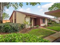 Charming single-story home with well-maintained lawn and inviting front entrance at 7501 Greystone Dr, Hudson, FL 34667