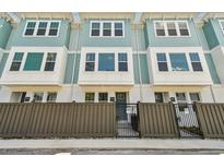 Charming townhome featuring a modern design and gated front yards for added privacy and curb appeal at 2121 1St N Ave, St Petersburg, FL 33713