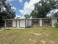 View of the home's exterior with stone accents, offering style and curb appeal at 1204 E Camellia Dr, Brandon, FL 33510
