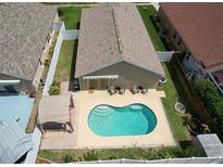 Aerial view of home showing a beautiful pool and spacious backyard at 1666 Meadow Oak Ln, Tarpon Springs, FL 34689
