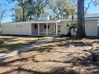 Charming single-story home with a covered porch and well-maintained front yard at 4310 7Th S St, St Petersburg, FL 33705