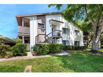 Attractive condominium with well-maintained landscaping and covered walkways at 2363 Newburg Ln # B, Safety Harbor, FL 34695