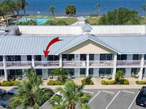 Waterfront condos offer balconies for enjoying coastal breezes and picturesque views at 611 Destiny Dr # 205, Ruskin, FL 33570