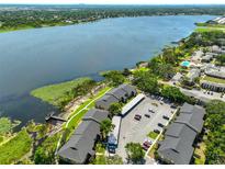 Stunning aerial view of the community, showcasing its lakeside location and convenient parking areas at 10100 Sailwinds N Blvd # 203, Largo, FL 33773