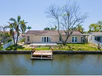 Waterfront home featuring a private wooden dock with direct access to the canal at 1419 47Th Ne Ave, St Petersburg, FL 33703