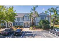 Charming two-story condo with well-manicured landscaping, ample parking, and a welcoming facade at 18236 Paradise Point Dr, Tampa, FL 33647