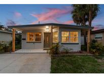 Charming home with a covered porch, updated tile and fresh exterior paint at 3066 Highland N St, St Petersburg, FL 33704
