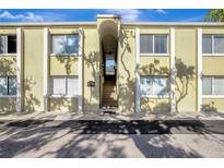 Inviting condo complex with stucco facade, trimmed windows and stairs leading to the upper units at 3206 W Azeele St # 126, Tampa, FL 33609