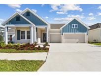 Charming single-Gathering home boasting a two-car garage and beautifully landscaped front yard at 5979 Hidden Branch Dr, Apollo Beach, FL 33572