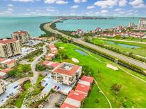 Stunning aerial view of community with golf course, waterway and Sarasota Bay in the distance at 6269 Palma Del Mar S Blvd # 206, St Petersburg, FL 33715