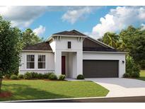 Contemporary home featuring stucco exterior, two-car garage, well-manicured lawn, and stylish architectural details at 12166 Cattleside Dr, Riverview, FL 33579