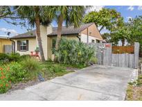 Charming single-story home with lush landscaping, palm trees, and inviting curb appeal in a desirable neighborhood at 251 72Nd Ave, St Pete Beach, FL 33706