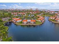 Stunning aerial view of waterfront condominiums with lush landscaping and boat docks at 6277 Bahia Del Mar Blvd # 110, St Petersburg, FL 33715
