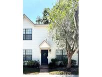 Charming two-story home with a welcoming front entrance and lush landscaping at 2302 Maki Rd # 24, Plant City, FL 33563