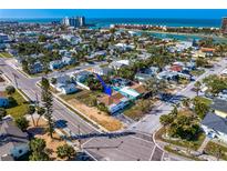 Coastal neighborhood featuring a home with a pool, set near the beach and waterfront at 500 79Th Ave, St Pete Beach, FL 33706