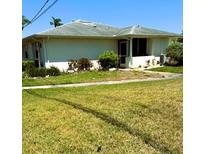 Charming single-story home with a well-maintained lawn and mature landscaping at 1903 Canterbury Ln # B2, Sun City Center, FL 33573