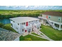 Two story duplex features an open balcony, large front yard, and waterway access at 8940 Rocky Creek Dr, Tampa, FL 33615