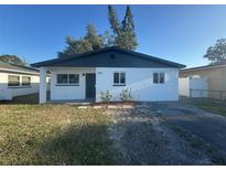 Charming single-story home with a fresh white exterior and dark trim at 342 51St N Ave, St Petersburg, FL 33703