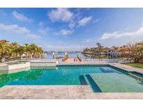 Inviting pool and dock with waterfront views create a relaxing outdoor oasis at 368 41St Ave, St Pete Beach, FL 33706