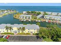 Scenic aerial view of waterfront community with docks, lush landscaping, and easy ocean access at 4740 Beach Se Dr # A, St Petersburg, FL 33705