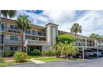 Well maintained multi-story building with mature tropical landscaping and convenient parking at 11720 Park Blvd # 301, Seminole, FL 33772