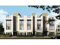 Modern townhome showcases a sleek design, large windows, and rooftop terraces for exceptional urban living at 4723 W Price Ave # 2, Tampa, FL 33611