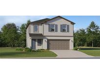 Charming two-story home featuring gray siding, a two-car garage, and manicured landscaping at 5607 Red Kite Dr, Wimauma, FL 33598