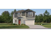 Charming two-story home features a craftsman-style facade, a two-car garage, and a well-manicured lawn at 13151 Empress Jewel Trl, Parrish, FL 34219