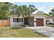 Charming single-story home with a well-maintained lawn and a one-car garage at 511 Glenoak N St, St Petersburg, FL 33703