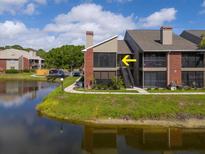 Waterfront condo features screened balconies and brick accents, offering serene views and outdoor living at 9100 Dr Martin Luther King Jr N St # 314, St Petersburg, FL 33702