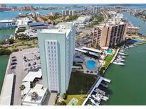 Stunning aerial view of the condominium, marina, and waterfront, perfect for boaters and water enthusiasts at 31 Island Way # 505, Clearwater Beach, FL 33767