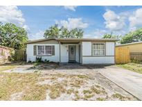 Charming single-story home with white siding and a well-maintained front yard at 4019 E Clifton St, Tampa, FL 33610