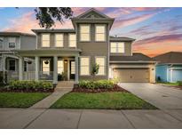 Beautiful two-story home featuring a covered porch, well-manicured lawn, and a two-car garage at 5949 Parkset Dr, Lithia, FL 33547