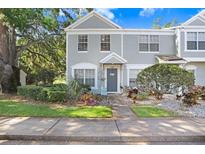 Charming townhome with a well-manicured lawn, tasteful landscaping, and inviting curb appeal at 2418 Lake Woodberry Cir, Brandon, FL 33510