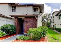 Charming two-story home with brick accents and well-maintained landscaping around the front entrance at 612 Fairmont Ave # D, Safety Harbor, FL 34695