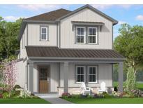 Charming two-story home featuring a covered porch and a combination of vertical and horizontal siding at 865 53Rd Ave N, St Petersburg, FL 33703