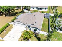 Charming single-story home with well-manicured lawn, long driveway and attached two-car garage at 37673 Dixie Ave, Dade City, FL 33525