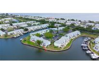Waterfront condo community with boat docks, parking, and lush landscaping at 5129 Se Salmon Se Dr # A, St Petersburg, FL 33705
