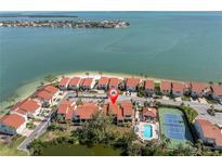 Waterfront community featuring a pool, tennis court, and beach access with beautiful views at 5559 Escondida S Blvd, St Petersburg, FL 33715