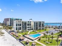 Beautiful waterfront condominium featuring a pool, beach access, and well-manicured grounds at 1400 Gulf Blvd # 511, Clearwater Beach, FL 33767